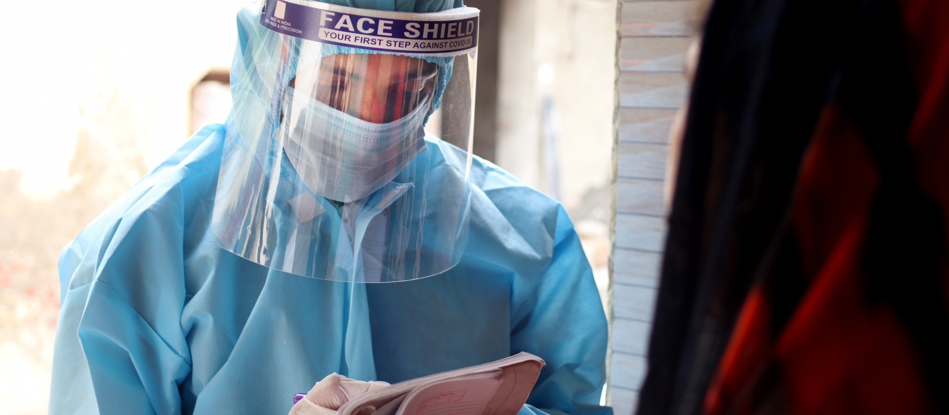 health-worker-in-PPE-house-visit
