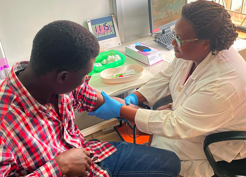 Doctor preparing a patients arm for a vaccination
