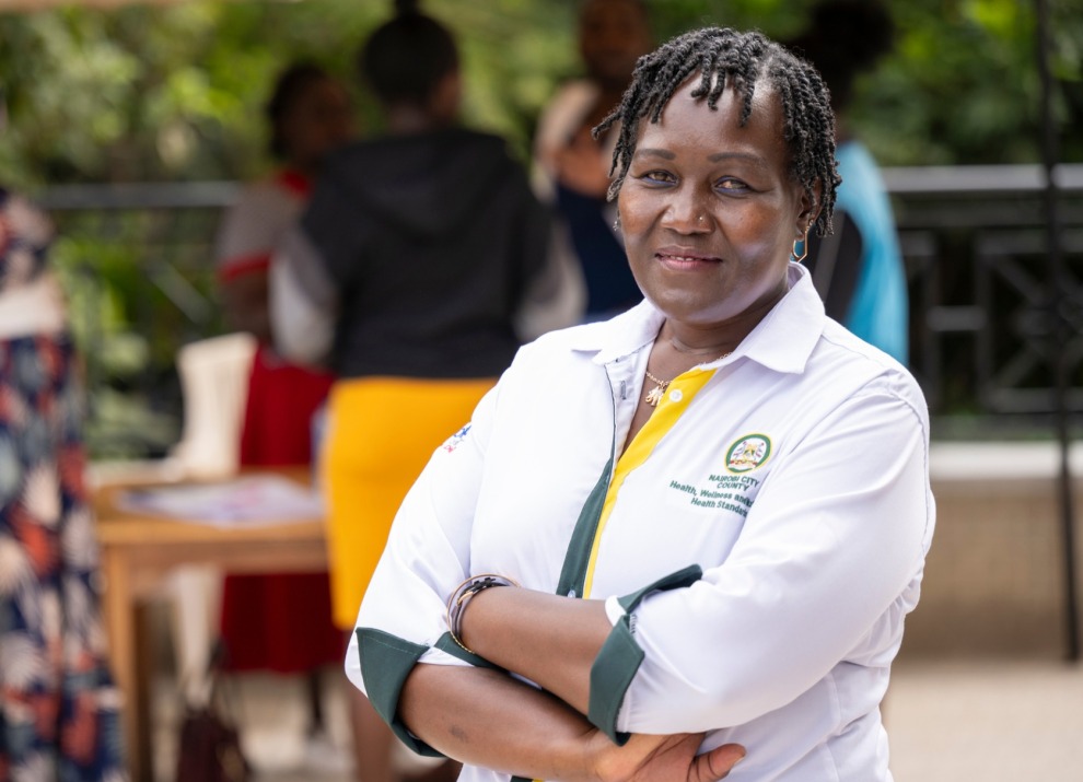 Lillyan Mutua smiling at a vaccination outreach.
